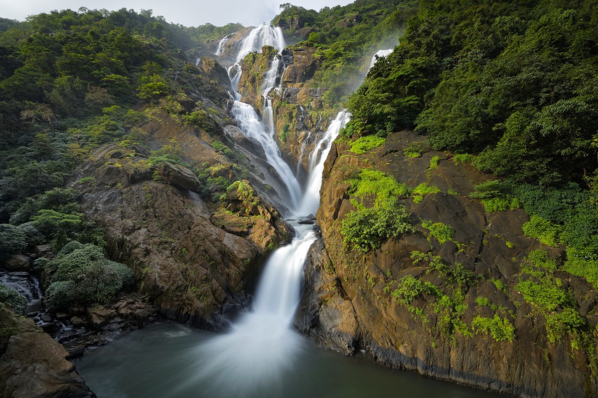 Dudhsagar Waterfall Goa surrounded by lush forests, cascading waters, scenic landscapes, and unforgettable nature adventure experiences together.