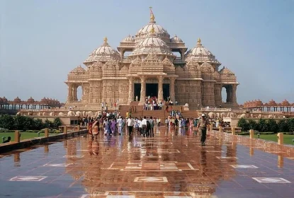 Devotees visiting Akshardham Temple in Delhi showcasing grand Hindu architecture and intricate stone carvings