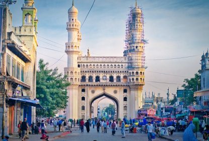 Charminar with bustling street market and historic Indo-Islamic architecture
