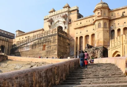 Visitors walking up steps at Amber Fort