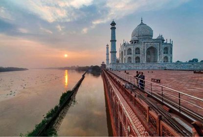 Taj Mahal at sunrise with Yamuna River view